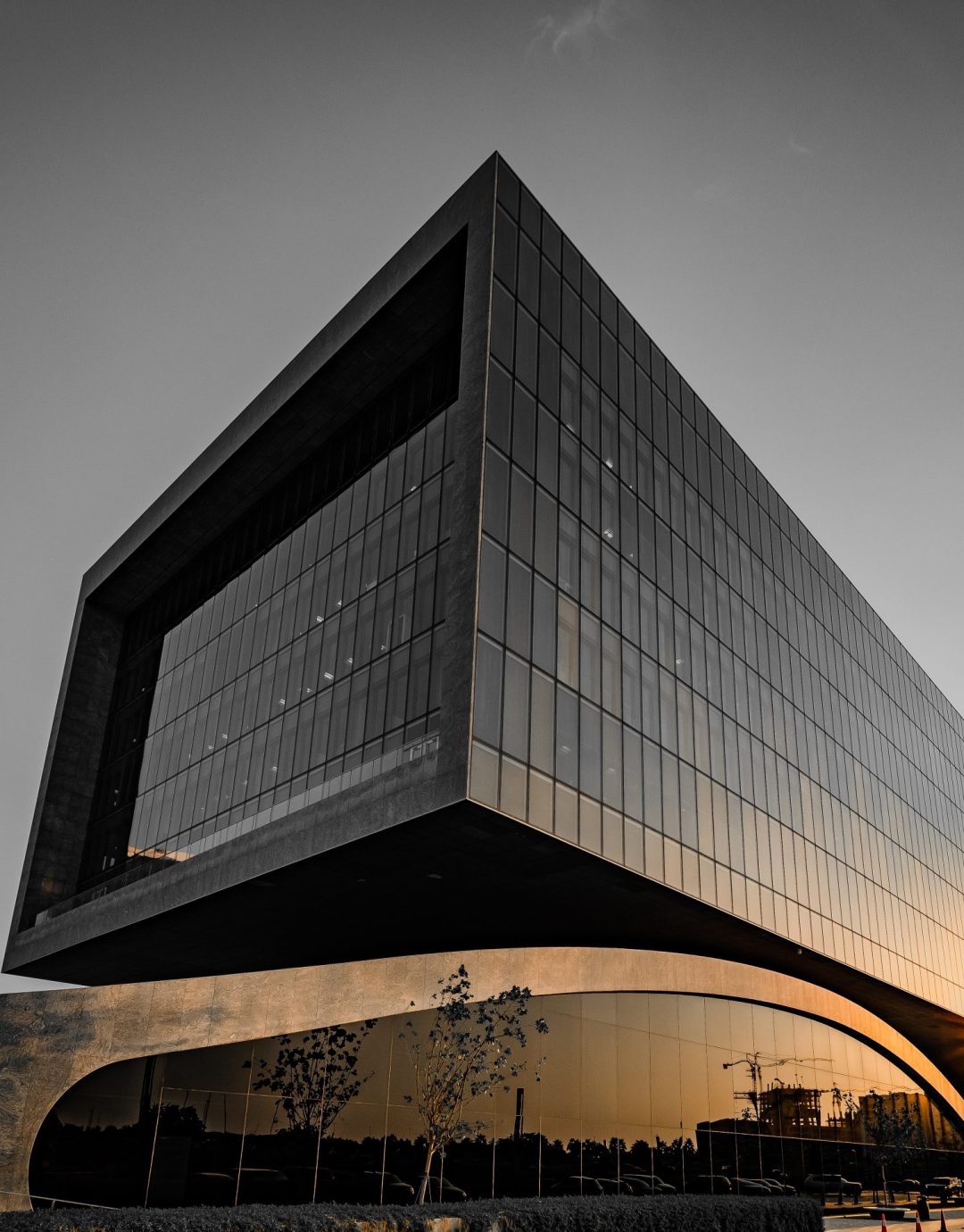 A closeup of a modern building with a cloudless sky in the background